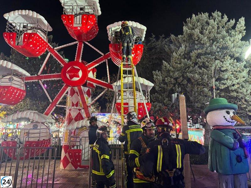 Rescatan a cinco personas, incluidos cuatro niños, de una noria en Móstoles.